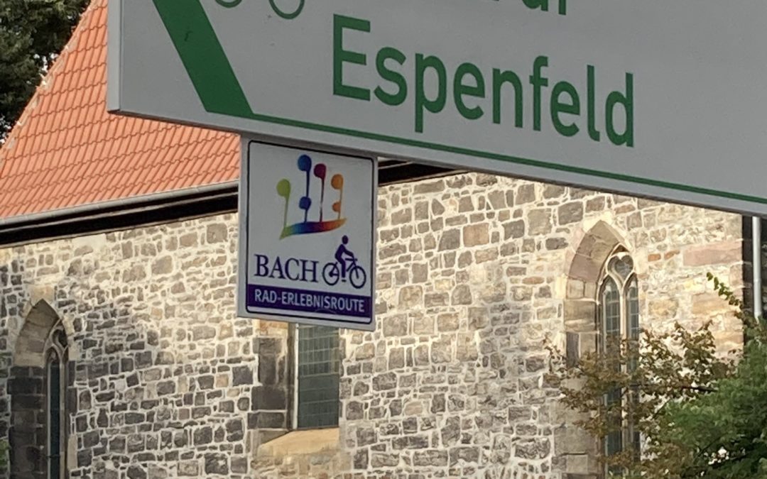 signpost in Arnstadt directly in front of Bach's church and showing the direction of the cycle route to Ohrdruf