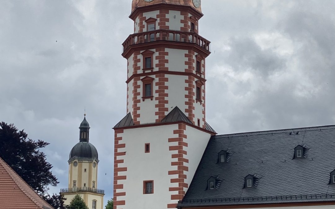 Picture of the castle tower in the foreground with the tower of St Michaelis in the background